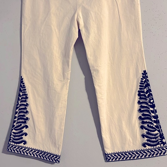 Tory Burch cream bell bottoms embellished with BLACK beads & BLACK embroidery